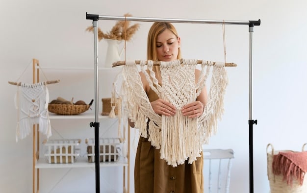 A person showcasing a capsule wardrobe of sustainable casual clothes on a clothing rack, including a white organic cotton t-shirt, a pair of ethically made jeans, a linen blazer, and a pair of sustainable sneakers.