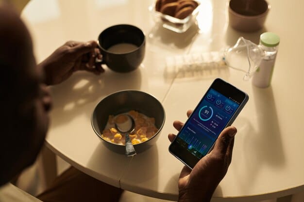 A person using a smartphone with a screen time tracking app open, displaying a pie chart showing time spent on different app categories. The background is a blurred coffee shop.