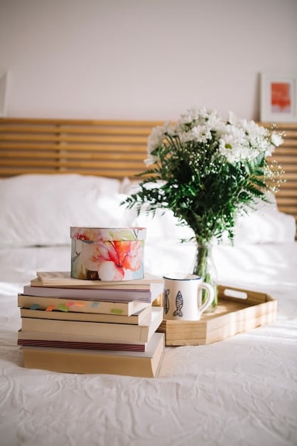 A bedroom setup with soft lighting, a comfortable bed, and a nightstand with flowers and a gratitude journal. The scene exudes peace and tranquility.