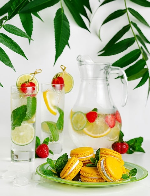 A refreshing image of sliced fruits (such as cucumber, lemon, and berries) infusing a glass pitcher of water, with a woman in the background sipping from a glass, emphasizing the importance of hydrated and healthy living.