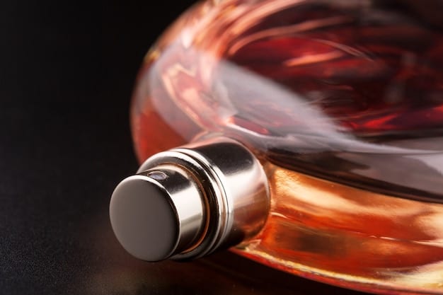 A close-up shot of a bottle of parfum, highlighting the viscous texture of the concentrated fragrance oil. The background is subtly blurred, emphasizing the luxury and intensity of the product.