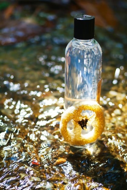 A close-up of perfume bottles stored both upright and sideways, with some bottles leaking around the sprayer.
