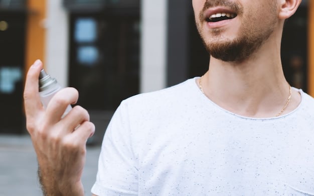 A person spraying perfume on their wrist. The focus is on the action of spraying and the delicate mist of fragrance in the air. The background is softly blurred, suggesting a personal and intimate setting.