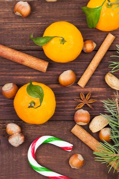 A close-up shot of fragrance ingredients, such as citrus fruits, spices, and flowers, artistically arranged to represent the different notes of a perfume. The image is vibrant and visually appealing, highlighting the natural sources of fragrance components.
