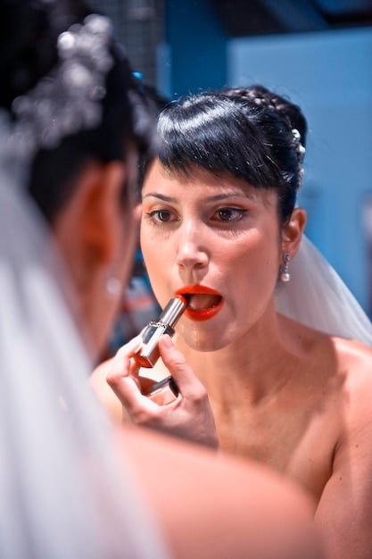 Close-up of a bride's lips with perfectly applied, long-lasting matte lipstick, soft focus, bridal setting