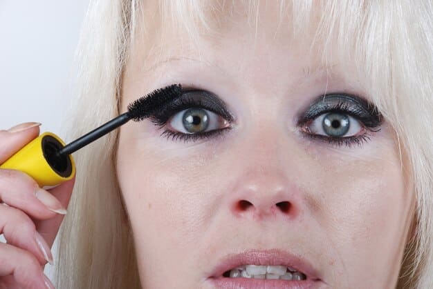 A person's open eye showcasing perfectly applied, voluminous false eyelashes with no visible band.