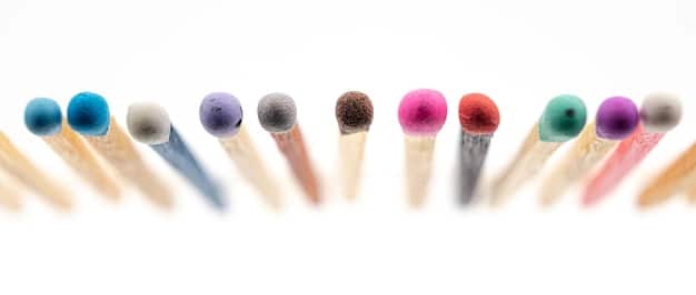 A close-up of various eye makeup brushes laid out, including blending brushes, shader brushes, and eyeliner brushes, with soft focus on the tips and bristles.