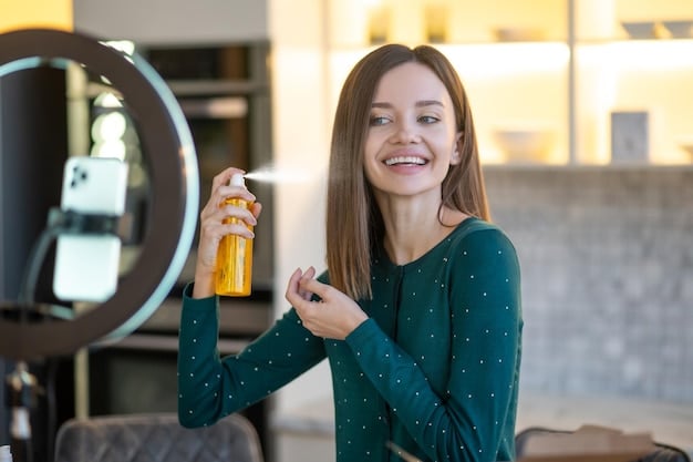 A person holding a setting spray, creating a fine mist over their face with a soft, blurred background, suggesting a refreshed and completed makeup look.