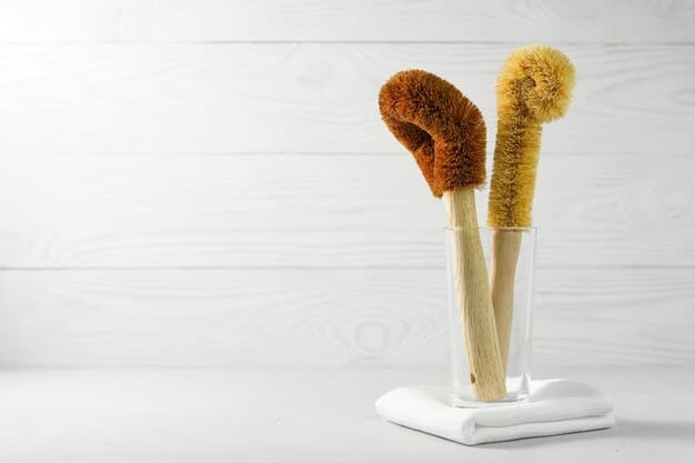 A variety of brush cleaning tools laid out on a clean, white surface: a silicone cleaning mat with different textures, a brush drying rack, and a few bottles of brush cleaning solution.