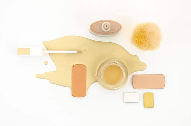 A flat lay of various contour and highlight products including cream sticks, liquid drops, and powder palettes. The products are neatly arranged with brushes, sponges, and possibly a mirror, emphasizing a well-curated makeup kit.