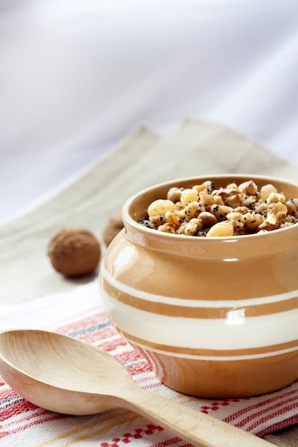 A close-up shot of a variety of nuts and seeds, including almonds, walnuts, chia seeds, and flaxseeds, neatly arranged in small ceramic bowls, emphasizing their texture and natural look.