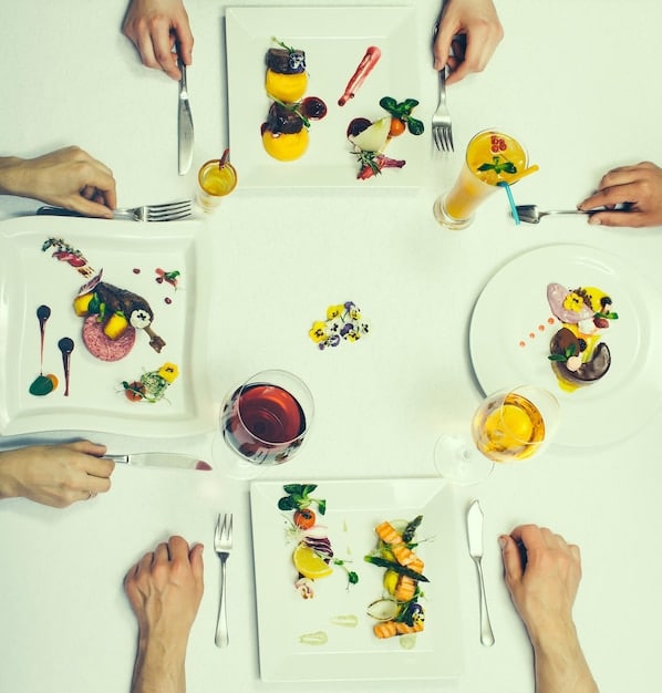 A vibrant, detailed overhead shot of a mindful eating scene, featuring hands respectfully holding a bowl of fresh, colorful vegetables and lean protein, emphasizing conscious consumption and healthy portions.
