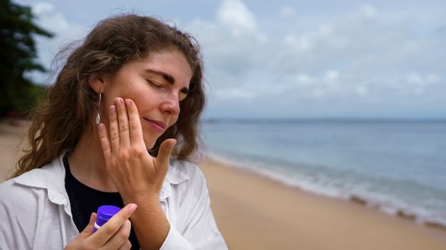 A close-up of a person applying a lightweight, clear sunscreen mist to their face in a sunlit outdoor setting. The mist is barely visible, emphasizing its fineness, and the person's skin looks fresh and dewy. The background is softly blurred with hints of greenery or a poolside environment.