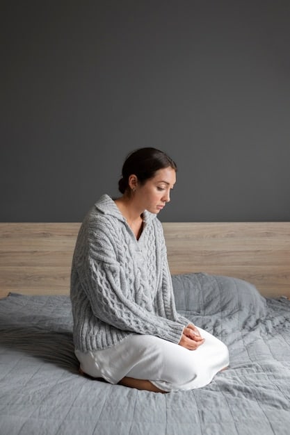 A calm person meditating in a warm, softly lit room, surrounded by cozy blankets, emphasizing mental relaxation and stress reduction.
