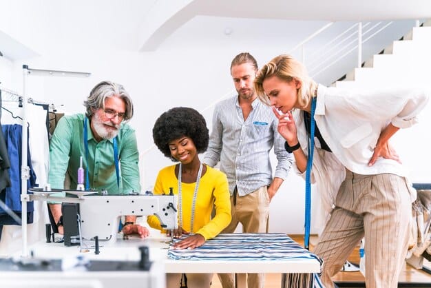 A diverse group of fashion industry professionals (designers, manufacturers, policy makers) in a modern, brightly lit conference room, actively discussing sustainable textile solutions, with digital presentations on screens.