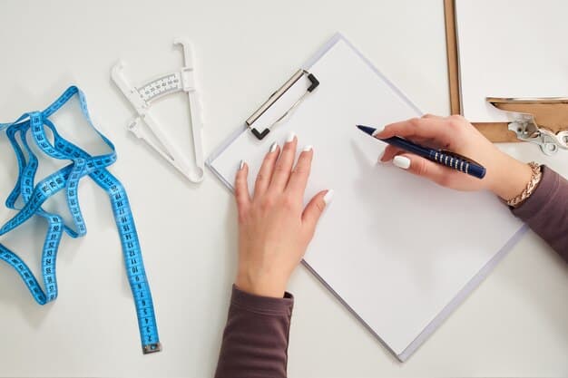 A close-up of hands sketching fashion designs, with measuring tapes and fabric samples scattered on a workbench, symbolizing the creative process and meticulous work of a fashion designer.