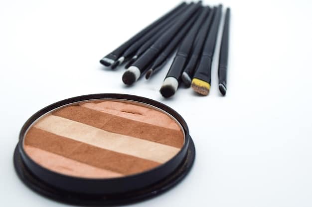 A selection of contouring products including powder palettes, cream sticks, and angled brushes. The image is set against a clean, minimalist background to highlight the different textures and shades of the products. The makeup is arranged in an organized manner, showcasing both high-end and drugstore options.