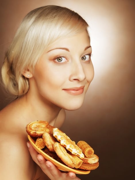 A woman's face with one side showing the makeup after baking and the other side before, highlighting the smoother and brighter appearance achieved through baking.