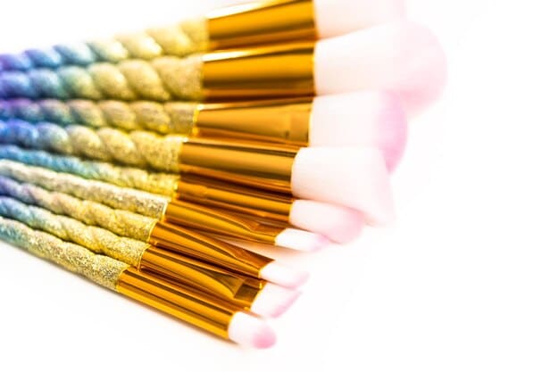 A selection of different makeup brushes laid out against a clean white background, each labeled with its specific use (e.g., foundation brush, concealer brush, eyeshadow brush). The image is well-lit and clearly shows the variations in shape and size of the brushes, reinforcing the principle of How to Choose the Right Makeup Brushes: A Guide to Essential Tools.