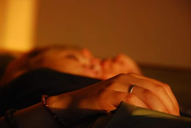 A serene image of a person sleeping peacefully in a dimly lit room, highlighting the importance of restful sleep in regulating metabolism and promoting fat loss, aligning with the 'Unlock Your Metabolism: 3 Science-Backed Strategies for 15% Faster Fat Burn' theme.
