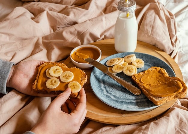 A close-up shot of a person preparing a pre-workout snack consisting of a banana and almond butter on whole-wheat toast. The image highlights the simplicity and healthiness of the snack.