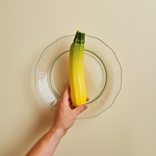 A person's hand holding a plate with sliced celery sticks. Next to the plate is a glass of water with lemon slices, illustrating a healthy and hydrating snack option.