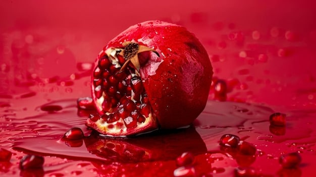 A close-up shot of a vibrant red pomegranate, freshly cut open to reveal its juicy arils, next to a bowl of assorted citrus fruits like oranges and lemons, highlighting fresh, healthy produce in a kitchen setting.