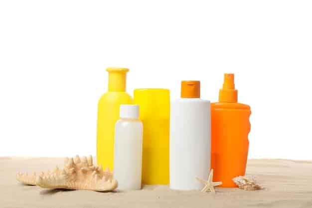 A close-up shot of various sunscreen bottles and hydrating skincare products arranged on a white background to illustrate the importance of sun protection and hydration as discussed in the Summer Beauty Forecast: Top 7 Skincare Trends for Sun Protection and Hydration in 2025. The products include SPF lotions, hydrating serums, and moisturizing creams designed for summer skincare.