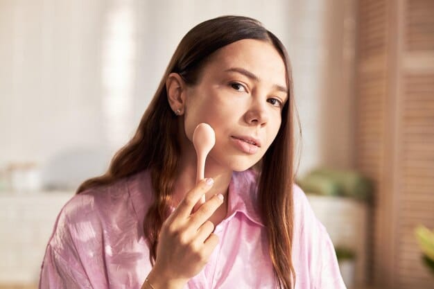 A woman applying cream blush to her cheeks with her fingertips. The focus is on the texture of the blush and how it blends seamlessly into the skin for Summer Makeup: Achieve a Natural, Sun-Kissed Glow with These 5 Lightweight Products in 2025.