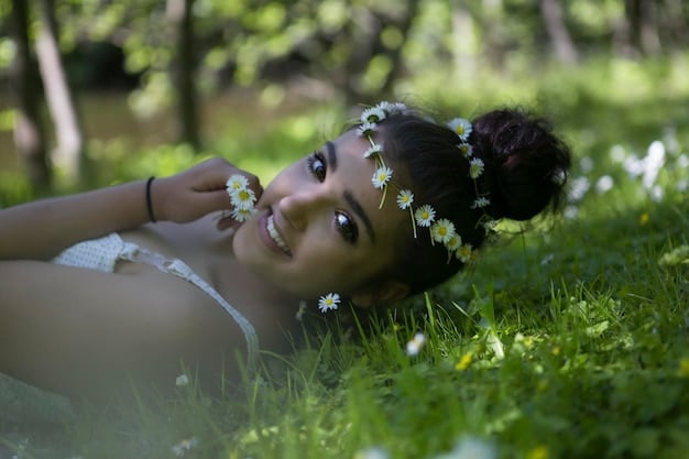 A close-up of a person sitting in a peaceful garden, eyes closed, focusing on their breath. The background is blurred with blossoming trees and gentle sunlight. Keywords: Mindful Breathing, Garden Meditation, Spring Peacefulness