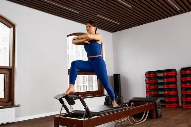 A person practicing a Pilates reformer exercise in a well-lit home studio, emphasizing the core engagement and controlled movements.